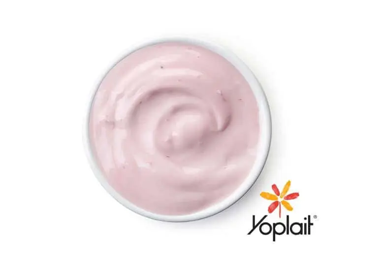 Overhead view of a cup of Yoplait Original Strawberry Yogurt.